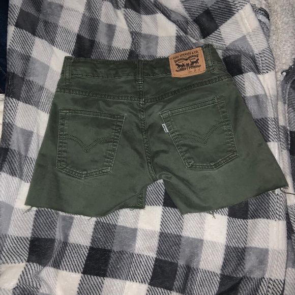 green levi shorts